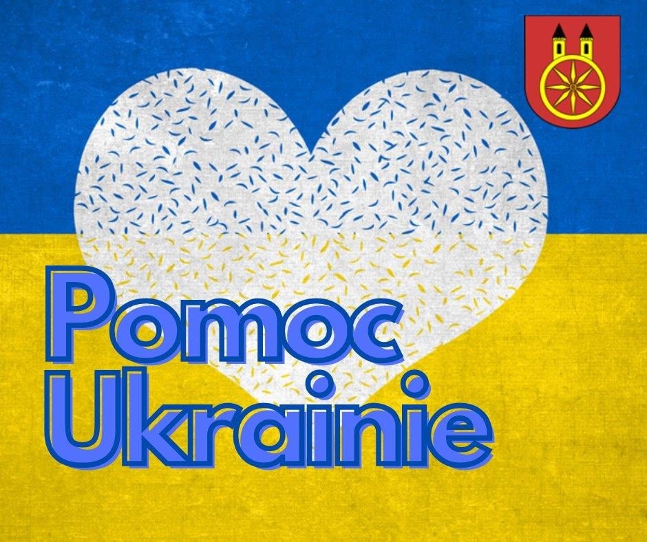 Plansza z napisem Pomoc Ukrainie, serce na tle barw narodowych Ukrainy, w górnym rogu herb Koła